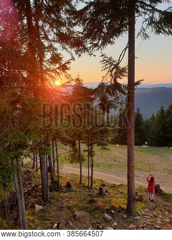 Young Girl Taking Picture With Phone Sunset In The Mountains, In Marisel, Cluj County, Transylvania,