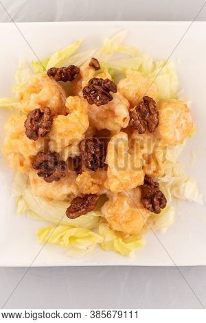 Appetizing Plate Tempting The Tastebuds With Honey Walnut Shrimp In Perfect Serving Size.