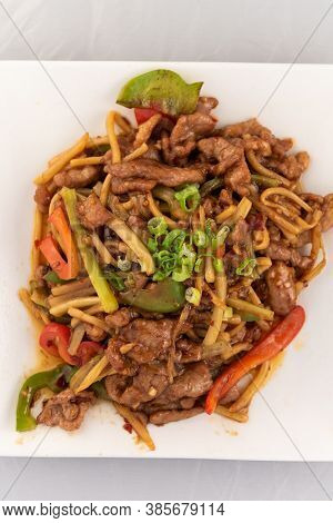 Appetizing Plate Tempting The Tastebuds With Pork Szechuan Style In Perfect Serving Size.