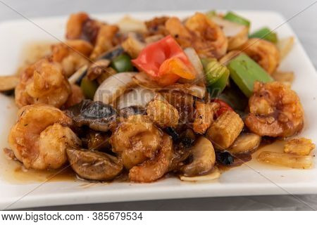 Detail View Of Appetizing Plate Tempting The Tastebuds With Shrimp In Black Bean Sauce In Perfect Se