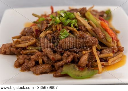 Detail View Of Appetizing Plate Tempting The Tastebuds With Pork Szechuan Style In Perfect Serving S