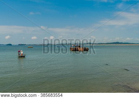 Seosan-si, South Korea; August 28, 2020: For Editorial Use Only. Small Fishing Trawler And Large Bar