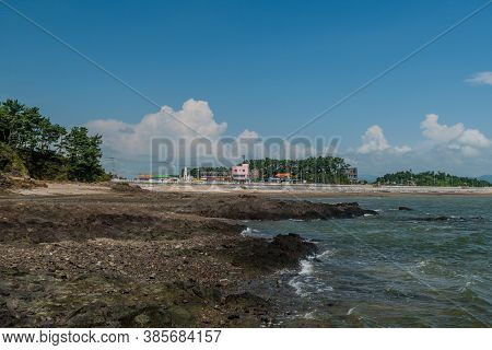 Seosan-si, South Korea; August 28, 2020: For Editorial Use Only. Rocky Ocean Coastline With Business