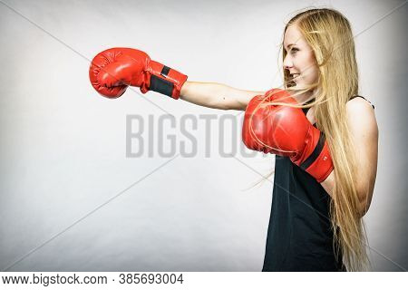 Girl In Red Gloves Playing Sports Boxing