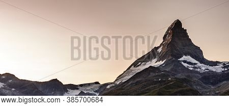 Zermatt, Switzerland. Matterhorn Mountain Near Grindjisee Lake With Flowers In The Foreground. Canto