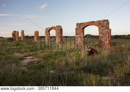 City Smiltene, Latvia.old Brick Stonehenge And Photographer.