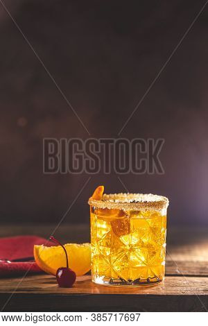Cocktail Negroni On A Old Wooden Board. Drink With Gin, Campari Martini Rosso And Orange, An Italian