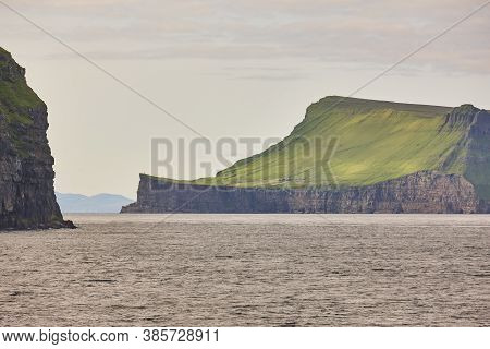 Picturesque Green Cliffs And Atlantic Ocean In Faroe Islands. Stora Dimun