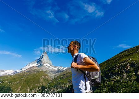 Active Family Hiking In High Alpine Region In Alps