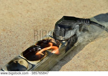 Outlets With Switche Caught Fire In Room. Overloaded Electrical Current Or Short In Device From Many