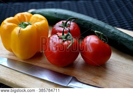 Closeup Of Fresh Vegetables On A Wooden Board