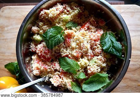 In Front Of A Window. Couscous With Mint, Tomato, Lemon And Olive Oil.