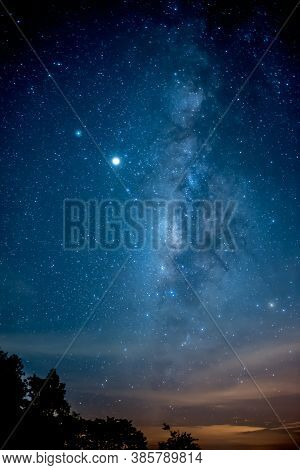 Color And Beautiful Milky Way Galaxy In The Night Sky, Ascending In A Straight Line In September, To