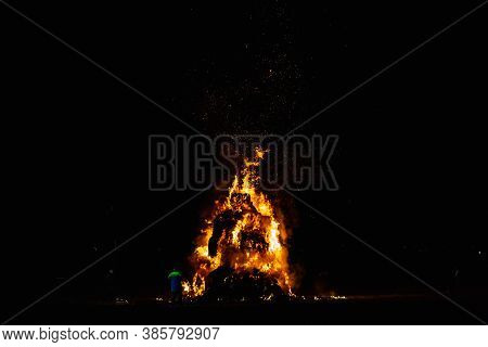 Ancient Tradition Of Epiphany Fires In Friuli, Italy. Burning Of A Straw Effigy. Farewell To Winter,