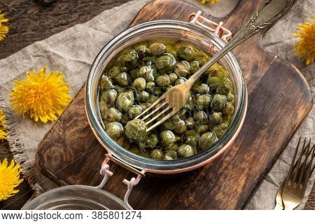 False Capers Made From Young Dandelion Buds In A Glass Jar