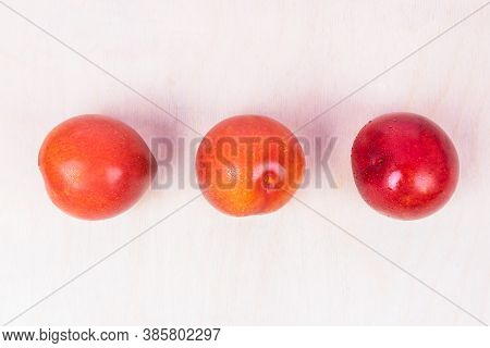 Red Plum Fruit On The White Background Isolated Top View