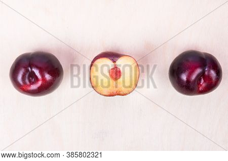 Red Plum Fruit On The White Background Isolated Top View