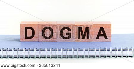 Dogma Word Concept Written On A Light Table And Light Background