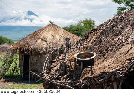 Traditional Maasai Village With Clay Round Huts In Engare Sero Area Near Lake Natron And Ol Doinyo L