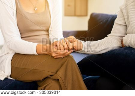 Caregiver Woman Holding Hands To Elderly With Alzheimer Disease At Home,adult Social Care Concept
