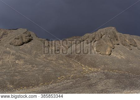 Bare Mountain In The Valley Of The River Murghab With Dark Rain Clouds Near The Village Of Murghab, 