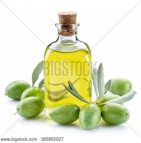 Green natural olives with bottle of olive oil isolated on a white background. 