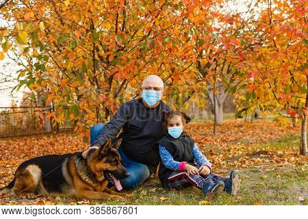 Grandfather And Granddaughter Wearing Face Mask During Coronavirus Outbreak. Virus Spread Flu Preven