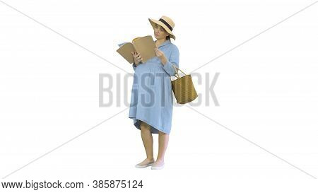 Pregnant Woman In A Summer Hat Reading Magazine On White Backgro