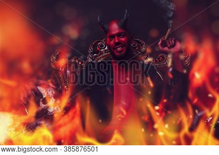 A portrait of a bad demon in his throne with a skull and cigar in fire. Horror movie, nightmare. Halloween.