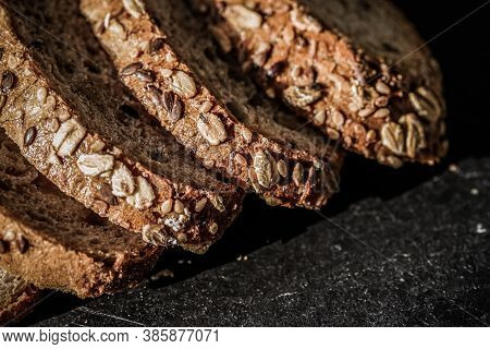 Fresh Whole Grain Seeded Bread, Organic Wheat Flour, Closeup Slice Texture As Background For Food Bl