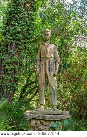 Lluc, Balearic Islands/spain; September 2020: Bronze Sculpture Surrounded By Vine Plants In A Medite