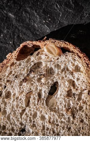 Fresh Whole Grain Seeded Bread, Organic Wheat Flour, Closeup Slice Texture As Background For Food Bl