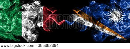Italy Vs Marshall Islands Smoky Mystic Flags Placed Side By Side. Thick Colored Silky Abstract Smoke
