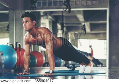 Trainer Man Exercise For  Functional Plank Training And Cross Fit The Gym Workout For Healthy Care A