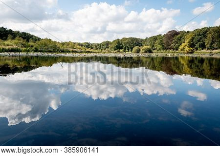 Lake Lonneker On A Sunny Day With Beautiful Cloud Reflections In The Water, In The Twente Region An 