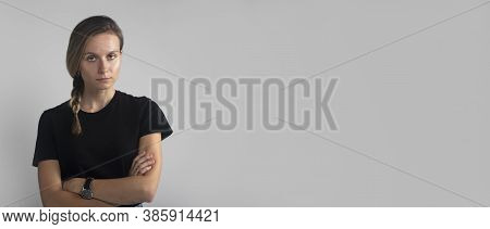 Woman Over Grey Studio Background. Bothered And Annoyed European Female Student Rolling Eyes And Sig