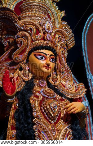 Face Of Goddess Laxmi At Decorated Durga Puja Pandal, Durga Puja Festival At Night. Shot Under Color