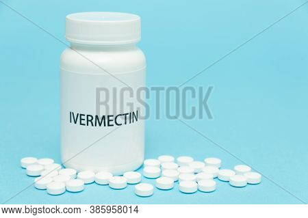 Treatments For Coronavirus (covid-19): Ivermectin In White Bottle Packaging With Scattered Pills. Is