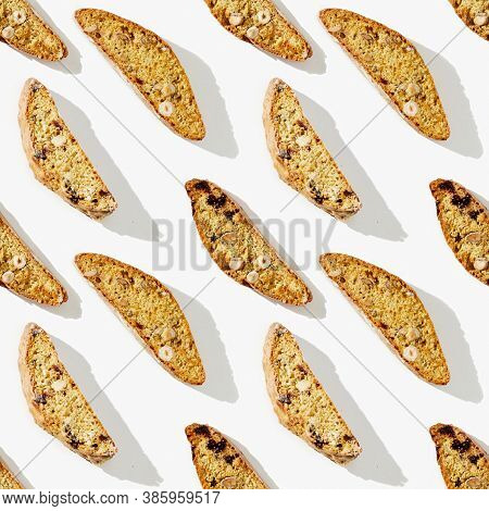 Seamless Pattern From Italian Biscotti Cookies On White Background. Fresh Broken Cookies With Nuts A