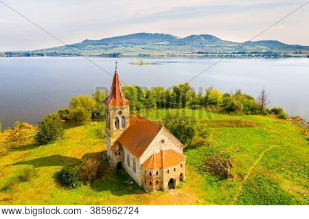 Ruins of Gothic Church of St. Linhart on island in  Vestonice reservoir. Aerial view to famous landmark on South Moravia, Czech Republic.