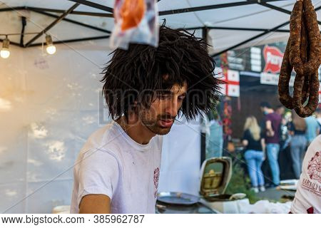 Kyiv, Ukraine - September 12, 2020: A Seller In A National Georgian Headdress During Mass Festivitie