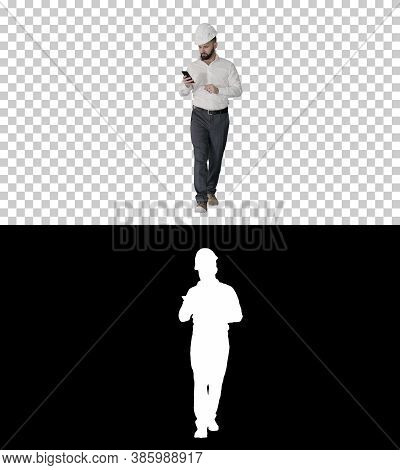 Engineer Walking And Using Smartphone, Alpha Channel With Silhou