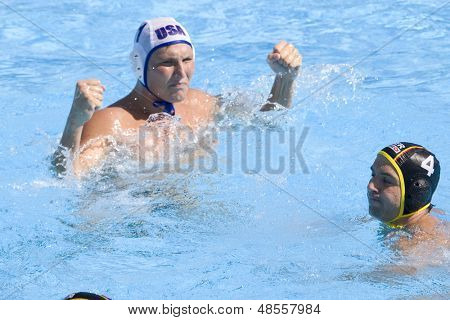 Jul 28 2009; Rome Italy; USA team player Jesse Smith celebrates scoring while German player Marko Savic looks on cduring the mens waterpolo quarterfinal match between USA and Germany