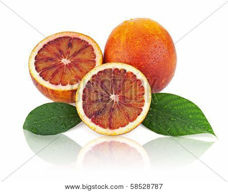 Ripe Red Blood Oranges With Cut And Green Leaves Isolated On White Background.