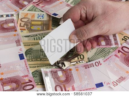 Hand With Business Card On The Money