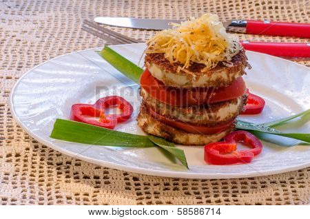 Fried Zucchini With Fresh Tomato And Grated Cheese