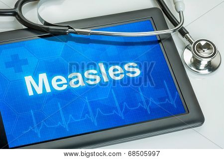 Tablet with the diagnosis Measles on the display