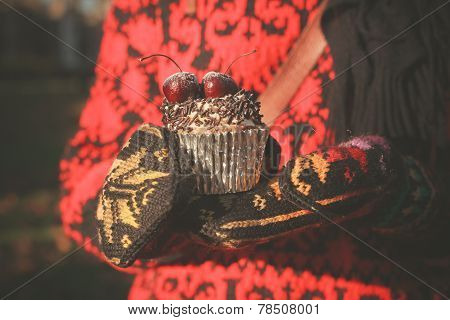 Gloved Hands With Cupcake