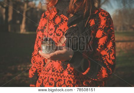 Woman In Park With Cupcake