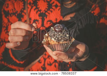Woman In Park With Cupcake